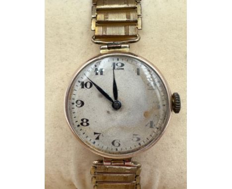A 1919 manual wind 15 jewel Rebberg movement Rolex Military trench watch, 9ct gold case on rolled gold Zenette strap. Rolex s