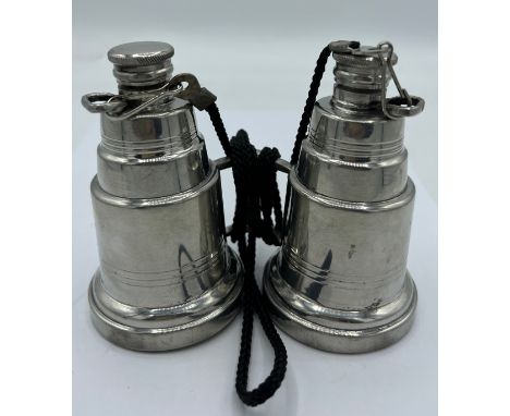 A novelty pewter hip flask modelled as a pair of binoculars, each eye piece unscrewing to form two flasks. Stamped English Pe