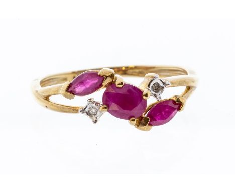 A ruby and diamond 9ct gold dress ring, set to the centre with a oval ruby, two marquise rubies set either side along with di