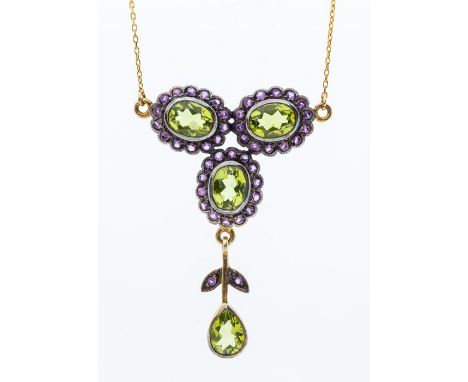 A silver and 9ct gold necklace set with peridots and amethysts, comprising a qua-trefoil cluster of peridots within a border 