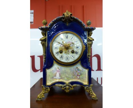 A 19th Century French porcelain and parcel gilt mantel clock