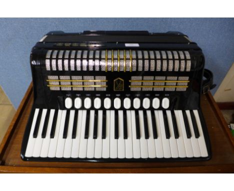 A Hohner Verdi V CB accordion, cased