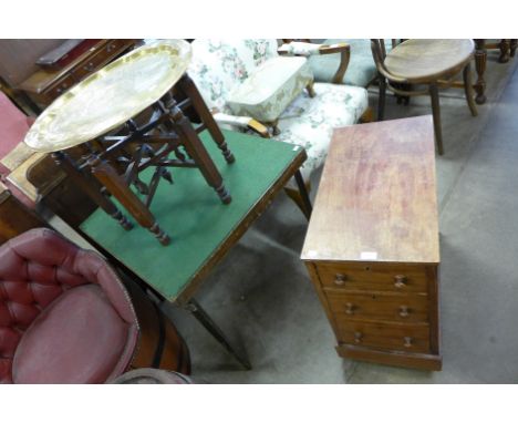 A folding card table, a brass top table and a small chest