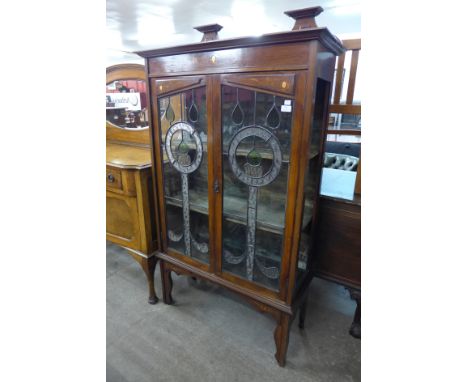 An Art Nouveau inlaid mahogany display cabinet