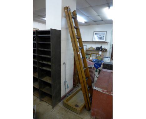 A vintage pine ladder and a stoneware sink