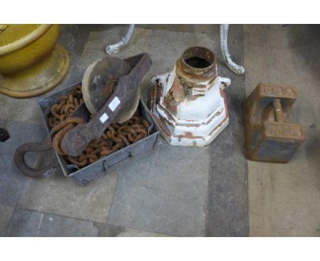 A cast iron pulley and chain, cast iron weight and a drain hopper