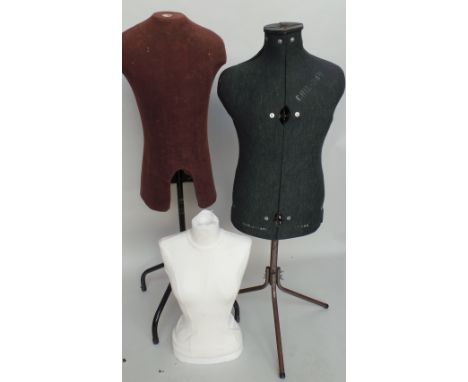 Two vintage male mannequins, a modern female torso (without stand) and a modern black and chrome circular rail.  One brown wo