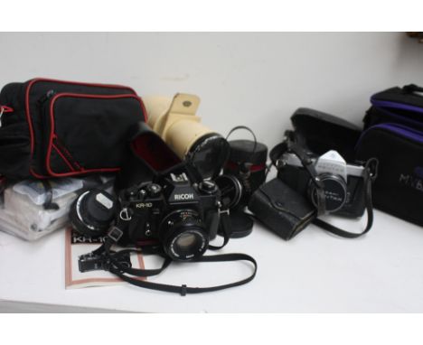 A box of cameras and camera equipment including Canon A1-1 QF, Vivitar Series 1 62mm lens, Cosina 200mm lens, Pentax lens, Si