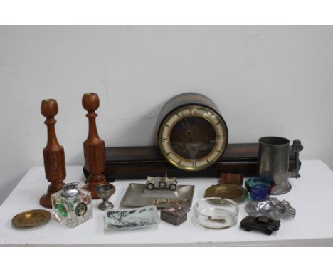 A box of mixed ietms including a pewter mug, a military themed table lighter, a pair of wooden candlesticks, two gold coloure