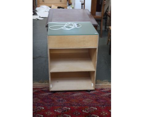 A two shelf storage unit with glass top and up lighting on castors 55cmW x 77cmH