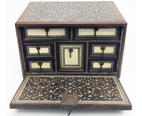 A fine early 18th century Indo-Portuguese ivory inlaid wooden table cabinet, rectangular form with hinged fall front, the top