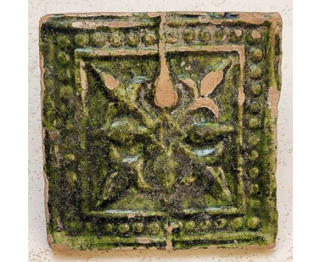 A rare 10th century Persian Ghaznavid green glazed pottery tile,  L.10cm W.10cm