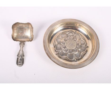 A silver pin dish with Tudor rose decoration and a Georgian silver caddy spoon with engraved decoration
