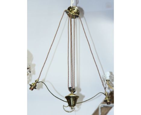 A brass two-light "rise and fall" pendant light, a pair of wall lights and other light fittings