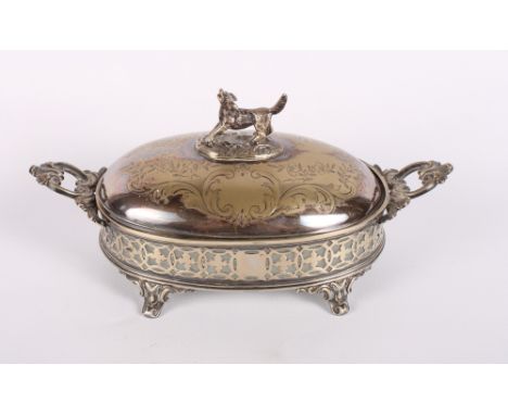 A 19th Century silver plated oval butter dish and cover with dog finial and glass liner