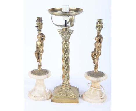 A pair of alabaster and gilt metal table lamps with cherub cast stems, 16" high, and a brass table lamp with twisted stem and