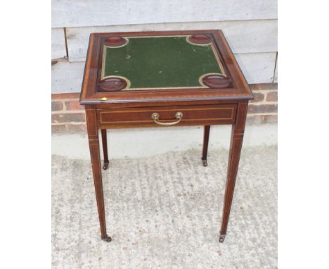 An Edwardian mahogany and kingwood and satinwood banded card table with rotating top, fitted one drawer, on square taper supp