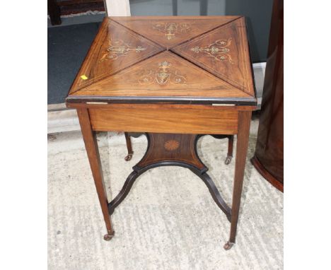 An Edwardian inlaid rosewood envelope card table, fitted shallow drawer and underplatform, 22" wide