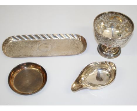 A silver pedestal bowl with embossed decoration, a Georgian silver pap boat (a/f), a silver oblong dish with planished decora