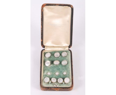 A set of six 14ct gold and mother-of-pearl dress studs, three matching collar studs and a matching pair of cufflinks, in fitt