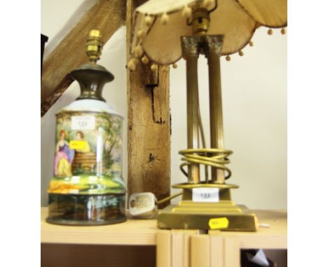A Victorian oil lamp base decorated landscape with two figures (fitted for electricity) and a brass table lamp on four reeded