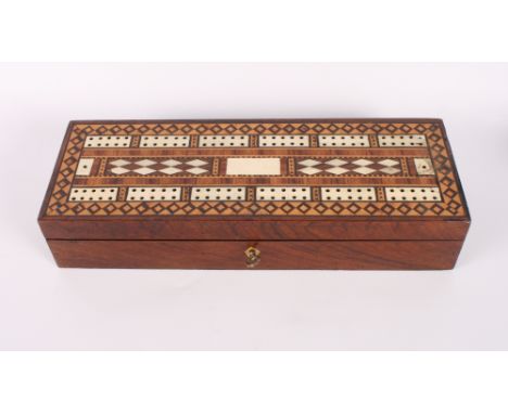 A 19th Century rosewood, mahogany and bone inlaid cribbage box with fitted interior, markers, dice, etc, 11 1/2" long