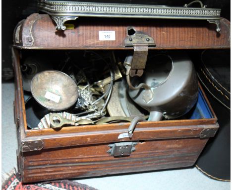 A copper kettle and a collection of assorted decorative brass items, in metal trunk