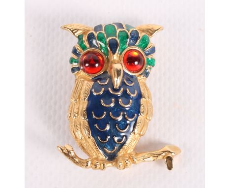 A collection of gilt metal and enamel decorated brooches featuring owls, horse, palette and fish by Solange Azagury-Partridge