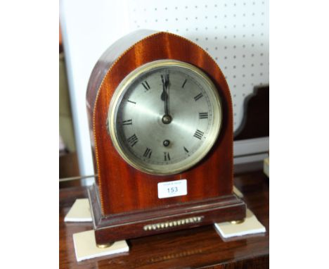 An early 20th Century mantel clock in lancet-shaped mahogany case, silvered dial