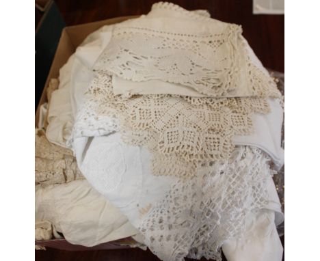 A collection of lace and textiles to include table linens, costume, collars, dress fronts, bonnets, baby gowns trimmed Valenc