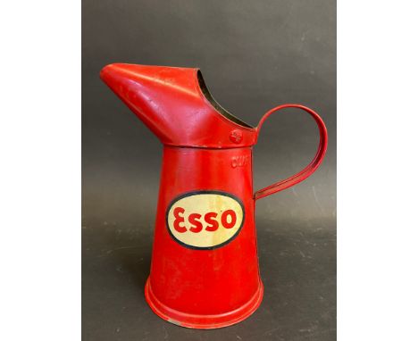 An Esso quart oil measure, in very good condition, dated 1955, tall version. 