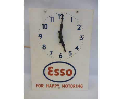 An Esso garage showroom perspex fronted advertising wall clock, 11 x 15".
