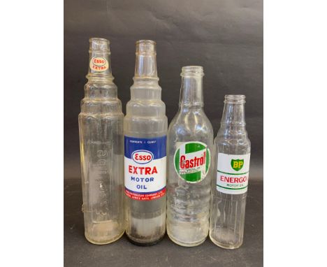Three quart glass oil bottles for Castrol, Esso Extra and Essolube, plus a BP Energol pint bottle. 