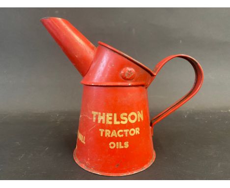 A Thelson Tractor Oils pint measure, in good condition. 