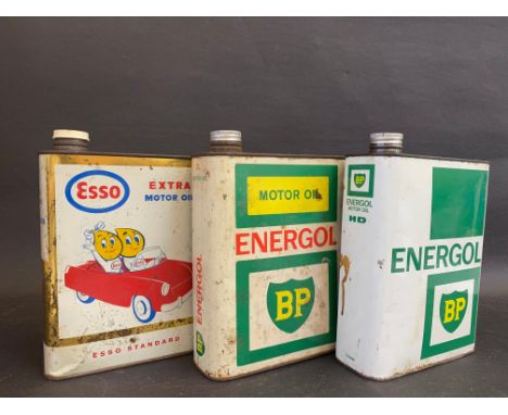 An Esso Extra Motor Oil can with image of Mr and Mrs Drip driving a car plus two further Continental cans. 