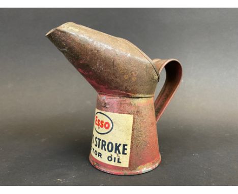 An Esso Two Stroke Motor Oil gill measure with a good decal, dated 1956.
