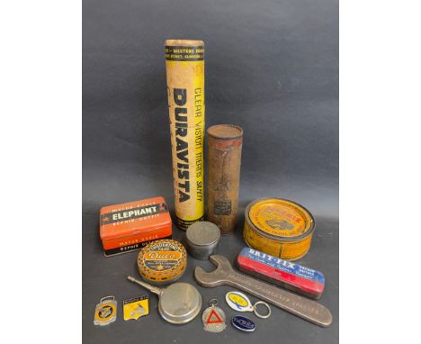 A box of mixed automobilia including cycle tins, Lucas oils, motoring tins, badges, key rings etc. 