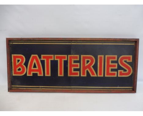 A 'Batteries' (Lucas) tin advertising sign in a wooden frame, 39 x 16 1/2".