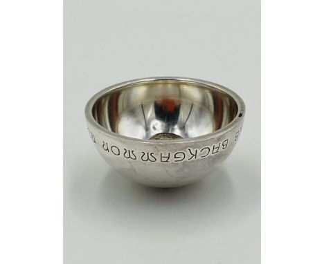 Georg Jensen silver candle holder with engraving to side dated 1973, height approximately 2.5cm. Estimate £50-70.This item qu