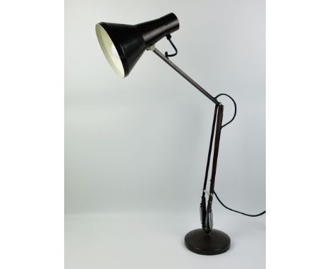 A weighted mid century brown Anglepoise style table lamp ,set upon a circular base, 87cms high x 15.5cms base diameter. Estim