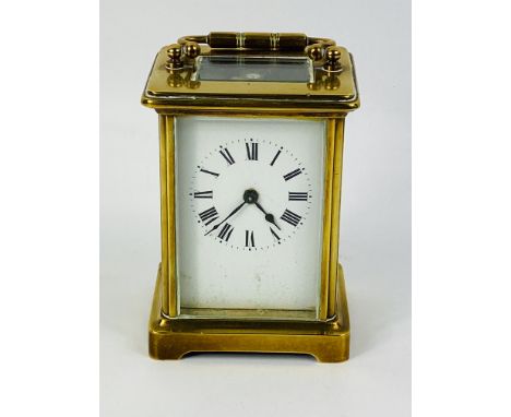 An early 20th century brass timepiece carriage clock, 8cms wide x 6.5cms deep x 11cms high. Estimate £20-40.