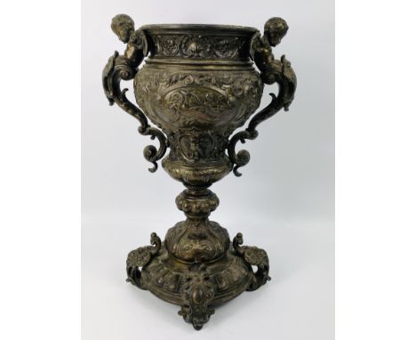 A decorative twin handled continental bronzed metal oil lamp base, cast in high relief throughout, circa 1900, 26cms wide x 3