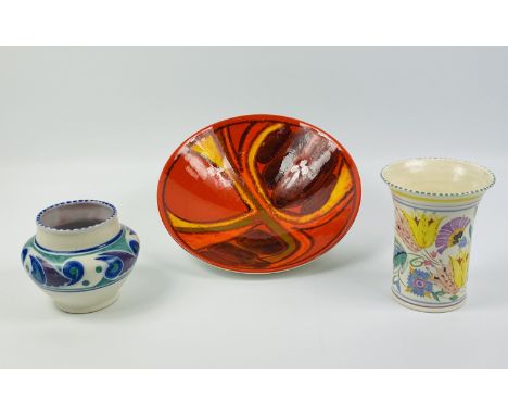 A group of three items of Poole pottery, all pieces with a back stamp: a circular bowl, 7cm high, 27cm diameter; a jar, 13cm 
