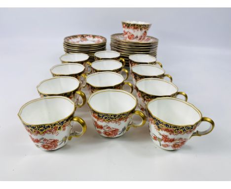 A Royal Crown Derby part tea service of cups, saucers, small side plates, 15.5cms diameter and a sugar bowl, backstamps to th