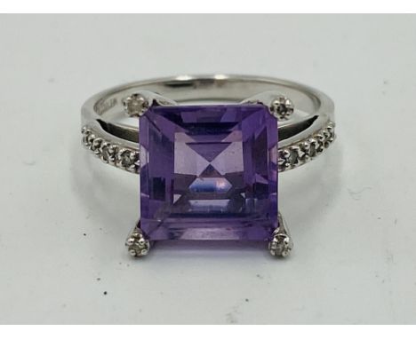 9ct white gold QVC ring, set with a mauve stone, 3.1g, size L. Estimate £60-80.