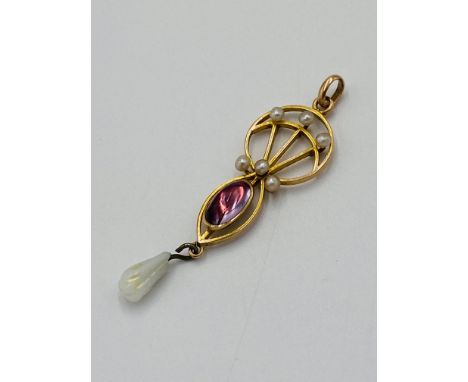 Yellow metal and pearl pendant, 1.4g. Estimate £30-50.