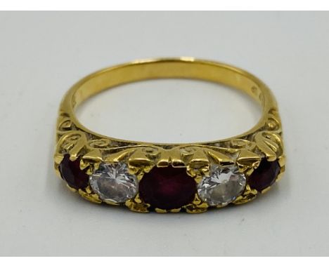 18ct gold five stone ring set with three rubies and two diamonds, size O, 4.6g. Estimate £200-300.