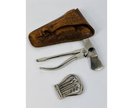 An early 20th century leather cased multi tool by A.Barrett &amp; Sons, 64 Piccadilly London, 19cms long x 13cms wide. Estima