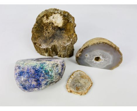 A polished geode together with a opal boulder, 9cms, a fossilised section of wood and a cross section of fossilised wood. Est