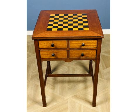 A square mahogany Georgian style inlaid games table with a chessboard top above four inlaid drawers with knob handles, and ra